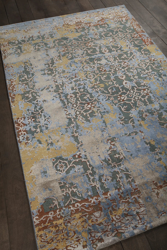 Chandra Vingel VIN-36803 blue and brown and gold and grey rug, angled side view