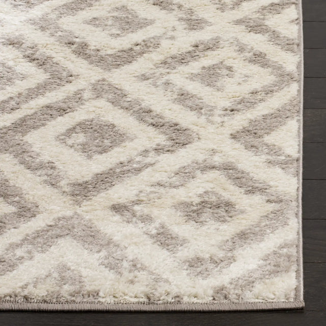 Safavieh Amsterdam 5'-1" x 7'-6" Rug in Ivory / Mauve