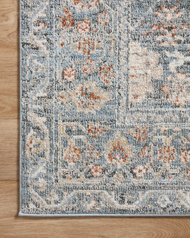 Loloi Odette Odt-07 Sky/Rust Rug - corner on wood
