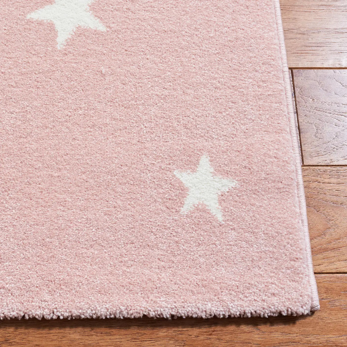 Safavieh Carousel Kids 100 4'-0" x 6'-0" Rug in Pink / White