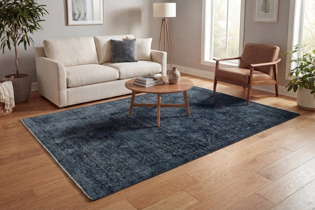 Traditional navy rectangular rug with subtle distressed pattern, power-loomed design