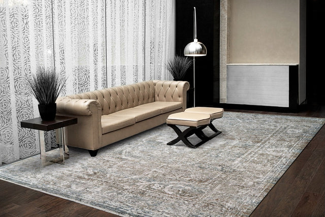 Traditional beige, ivory, and blue rectangular rug with ornate border pattern
