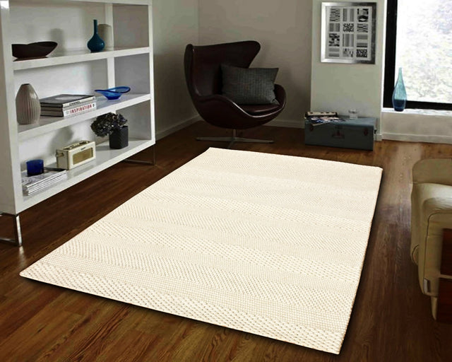 Ivory handmade modern rectangular rug with subtle textured pattern