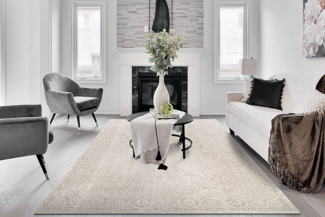 Cream traditional rectangle rug with ornate border and detailed medallion pattern