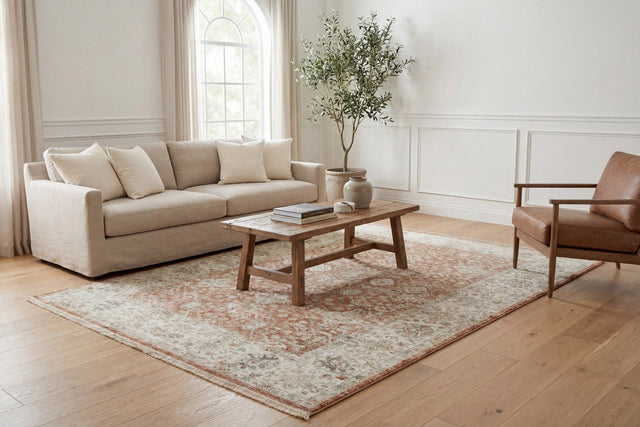 Power-loomed rust and cream traditional patterned rectangle rug