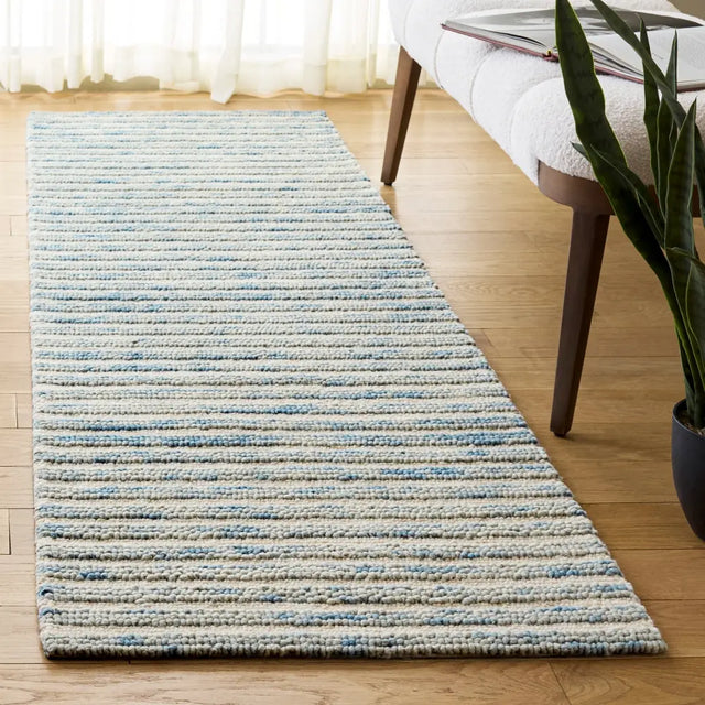 Safavieh Ebony 2'-3" x 8'-0" Rug in Light Blue / Ivory