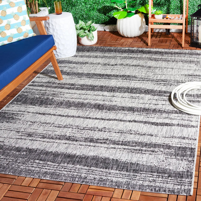 Safavieh Courtyard 5'-3" x 7'-7" Rug in Grey / Black