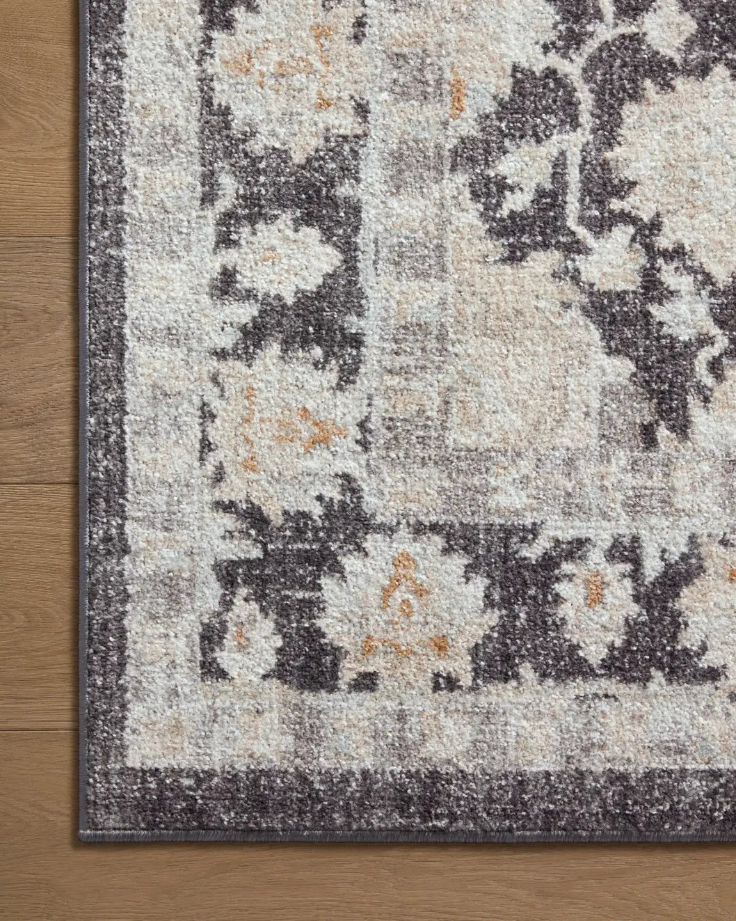 Loloi Monroe Mon-05 Charcoal/Natural Rug - corner on wood