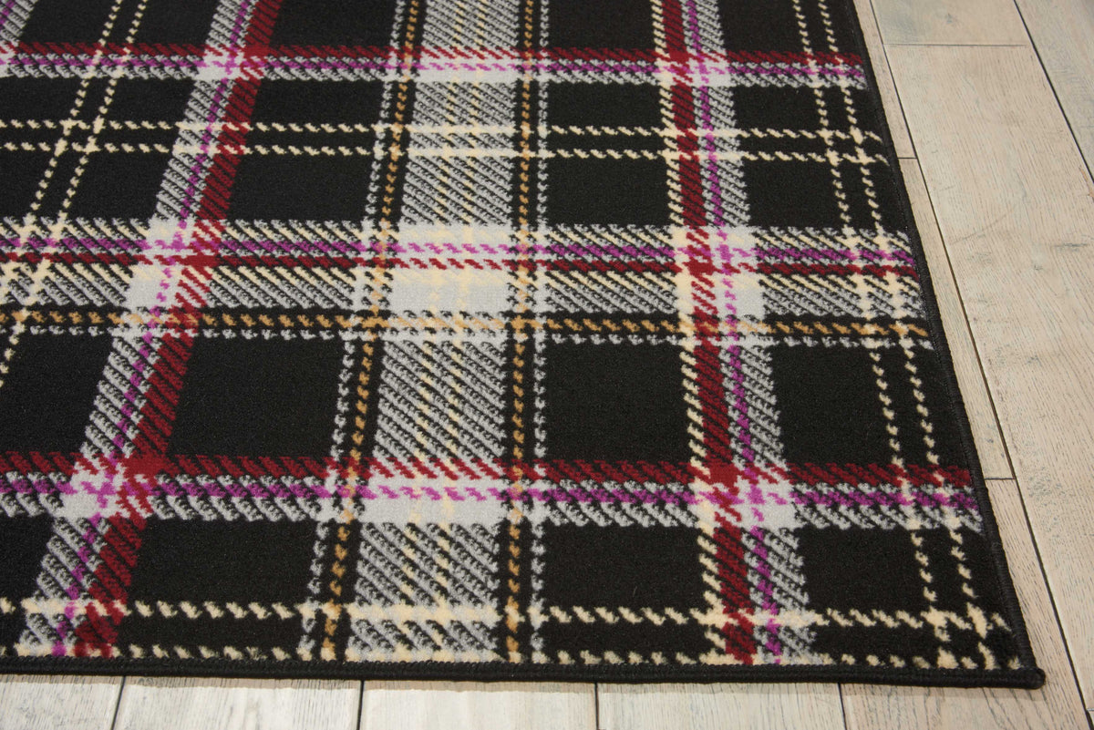 Rectangle black plaid area rug with cream, red, purple, and gold check lines