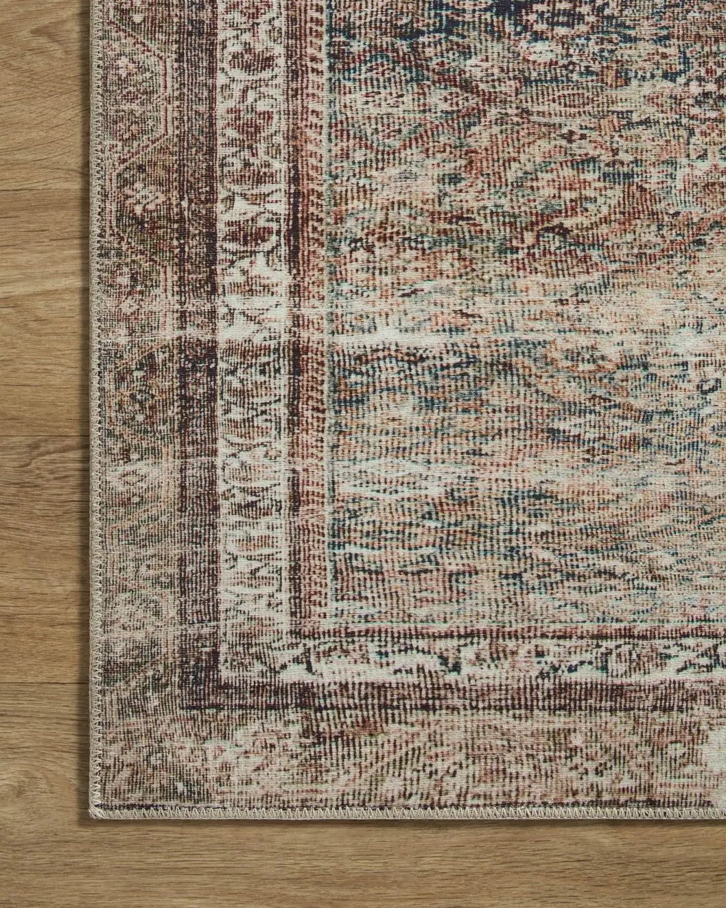 Chris Loves Julia x Loloi Jules 9-Jul Ink / Terracotta Rug - corner on wood