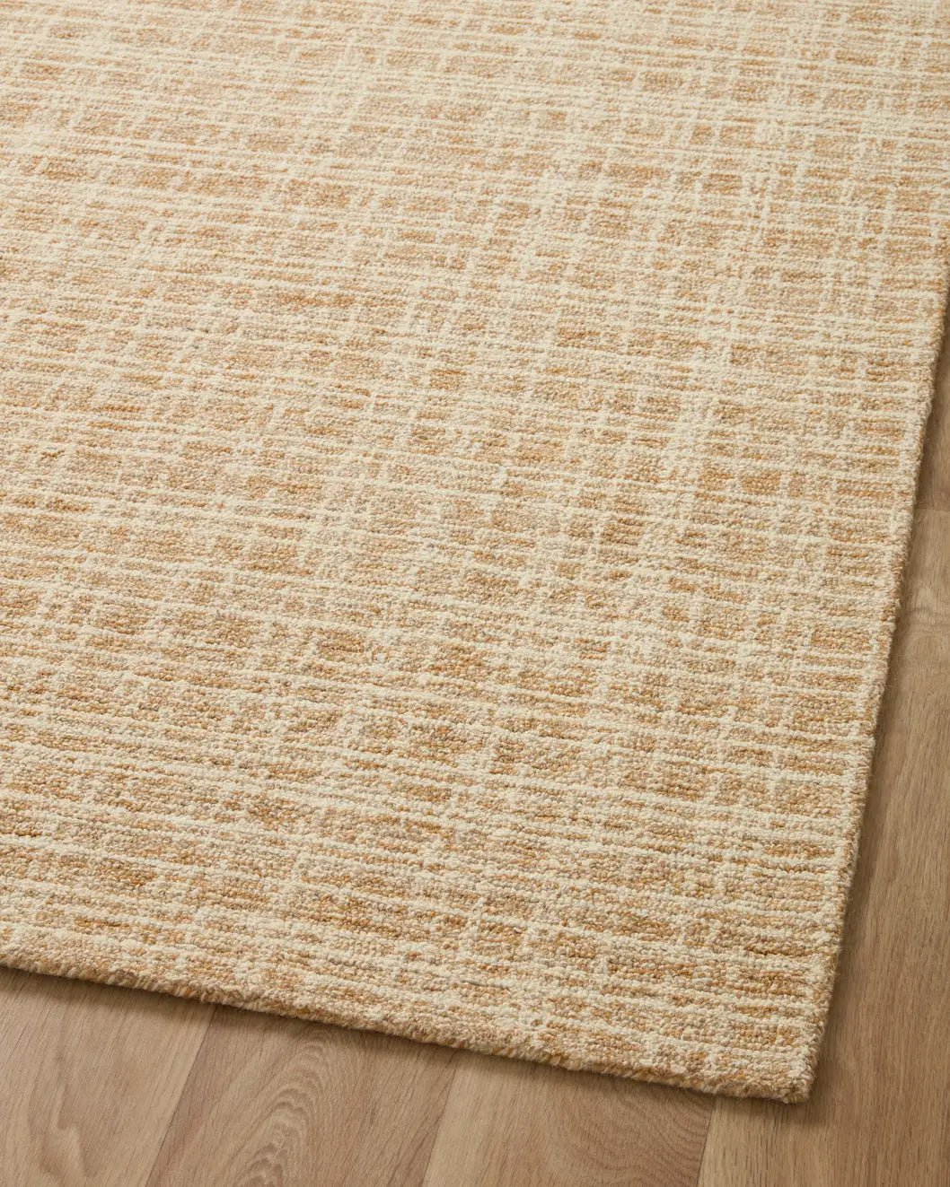 Chris Loves Julia x Loloi Polly POL-03 Straw / Ivory Rug - angled corner on wood