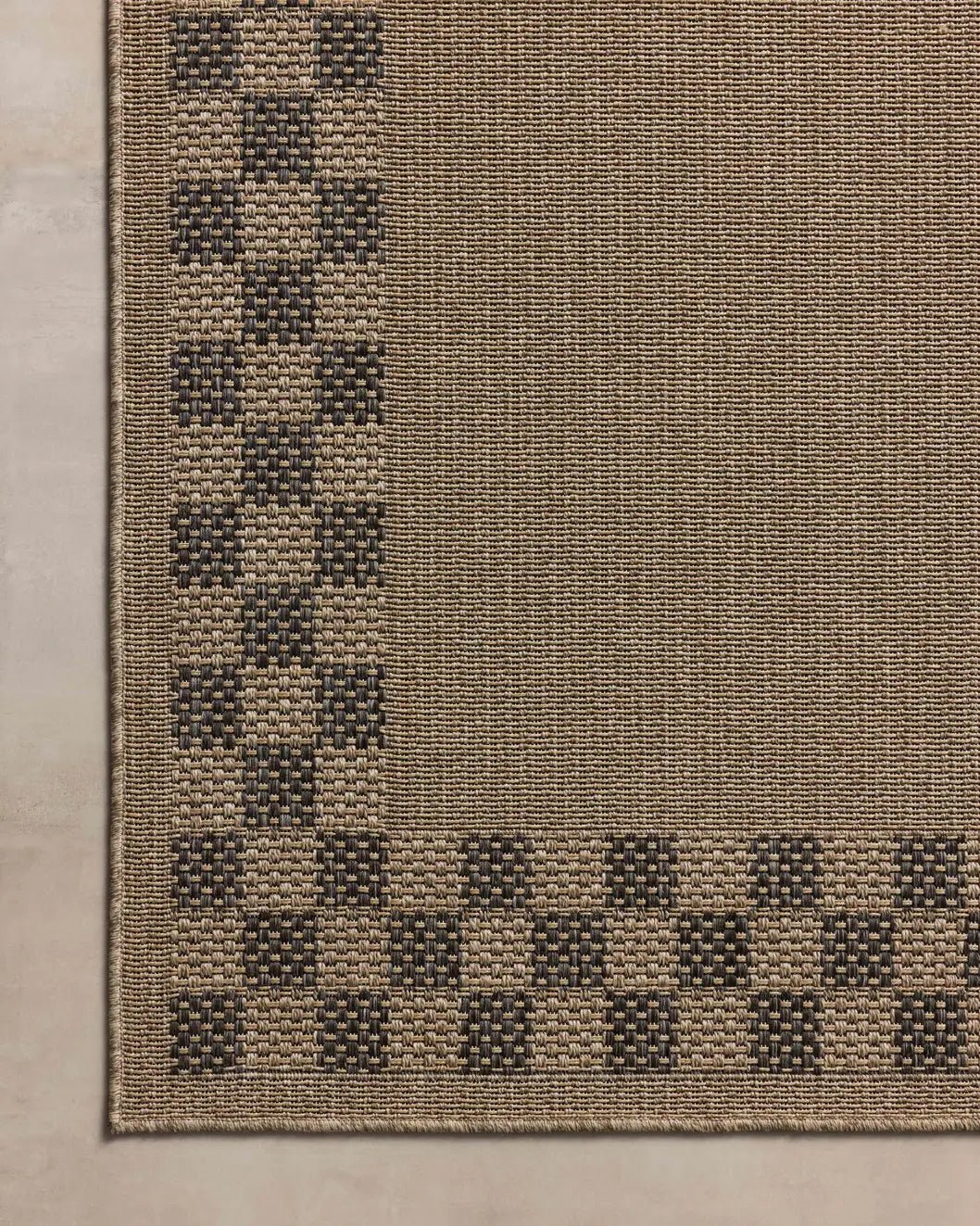 Chris Loves Julia x Loloi Providence PRC-01 Natural / Charcoal Rug - corner on wood