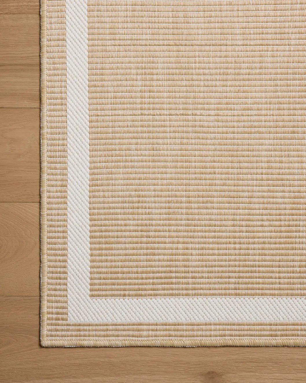 Loloi Easton ESN-05 Wheat / Ivory Rug - corner on wood
