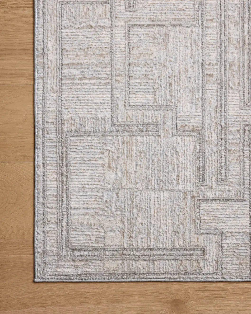 Loloi Hollis HOL-01 Grey / Ivory Rug - corner on wood