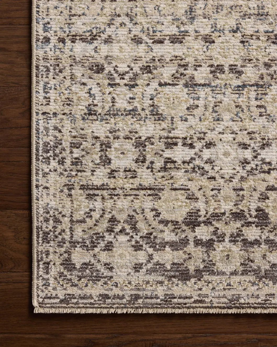 Loloi Milena MLE-03 Linen / Midnight Rug - corner on wood