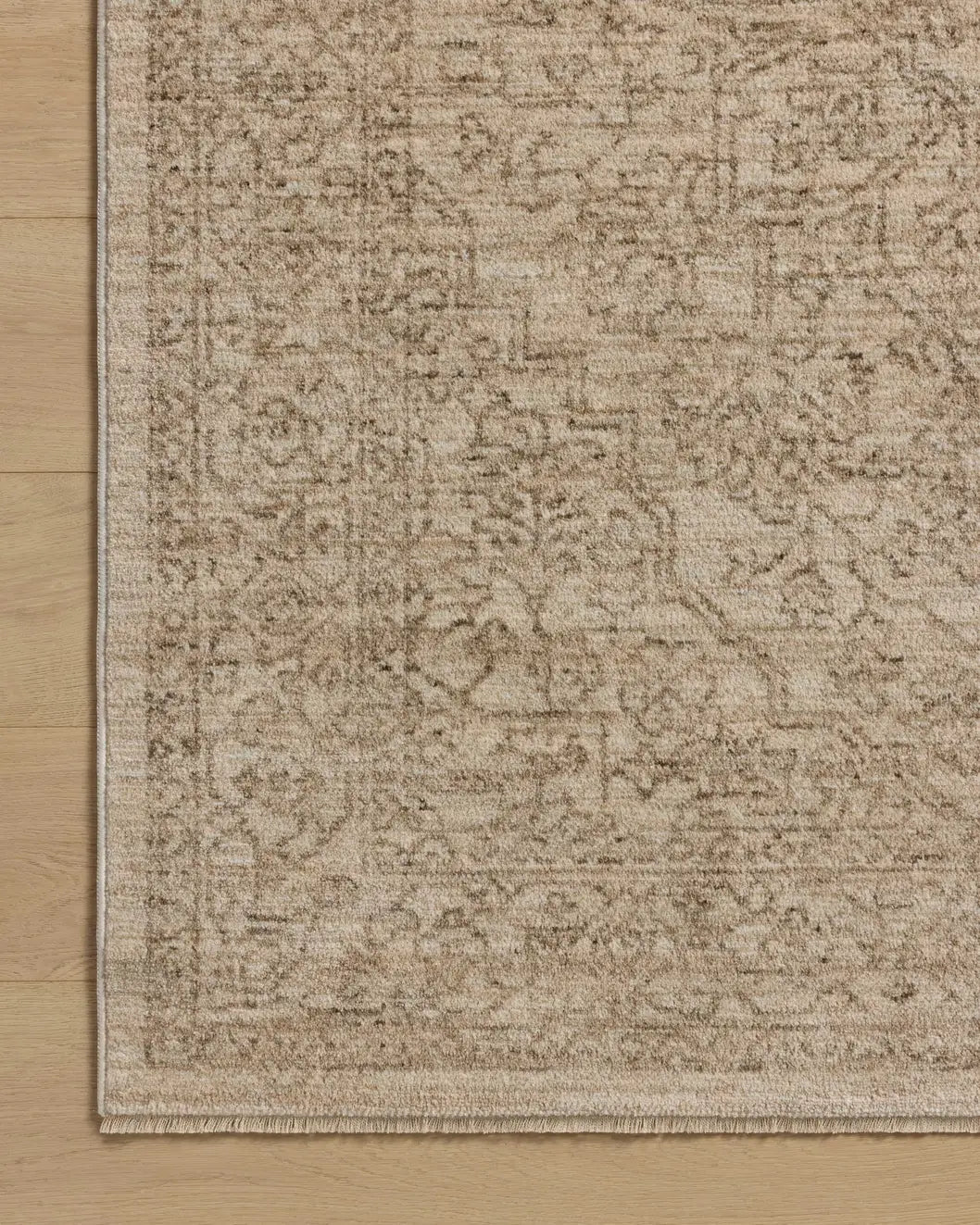 Loloi Newman NEW-01 Taupe / Bone Rug - corner on wood