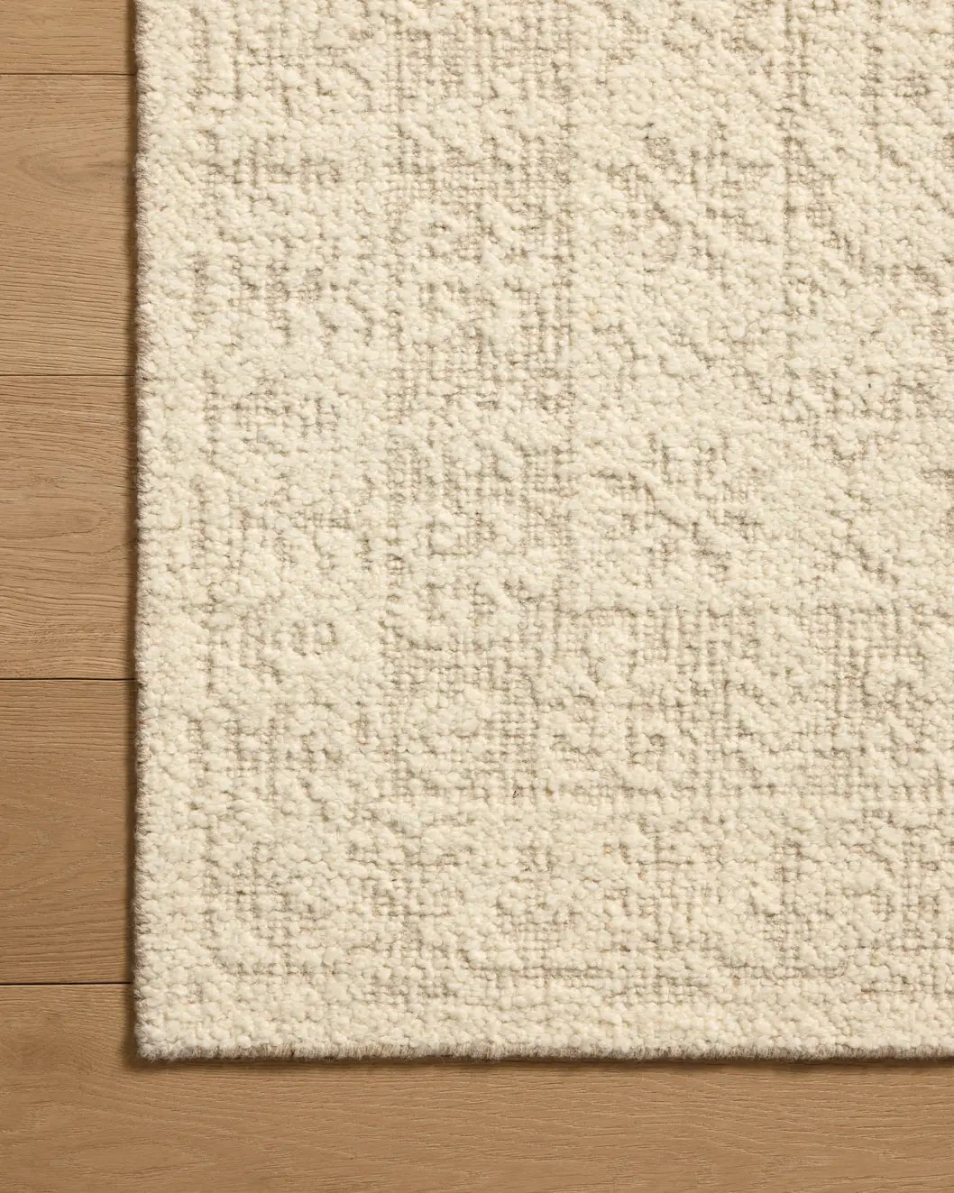 Loloi Novi NVI-01 Ivory / Dove Rug - corner on wood
