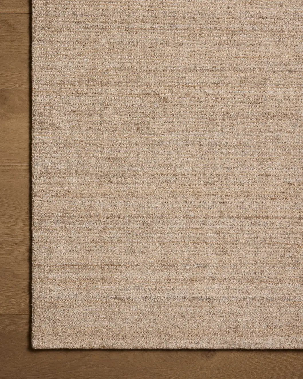 Loloi Thorne THT-01 Sand Rug - corner on wood