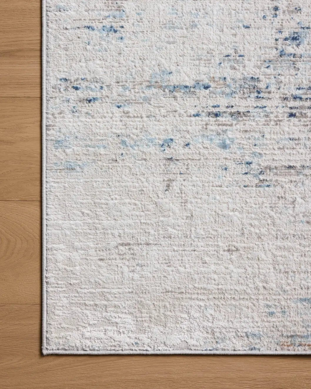 Loloi Townes TOW-04 Ivory / Sky Rug - corner on wood