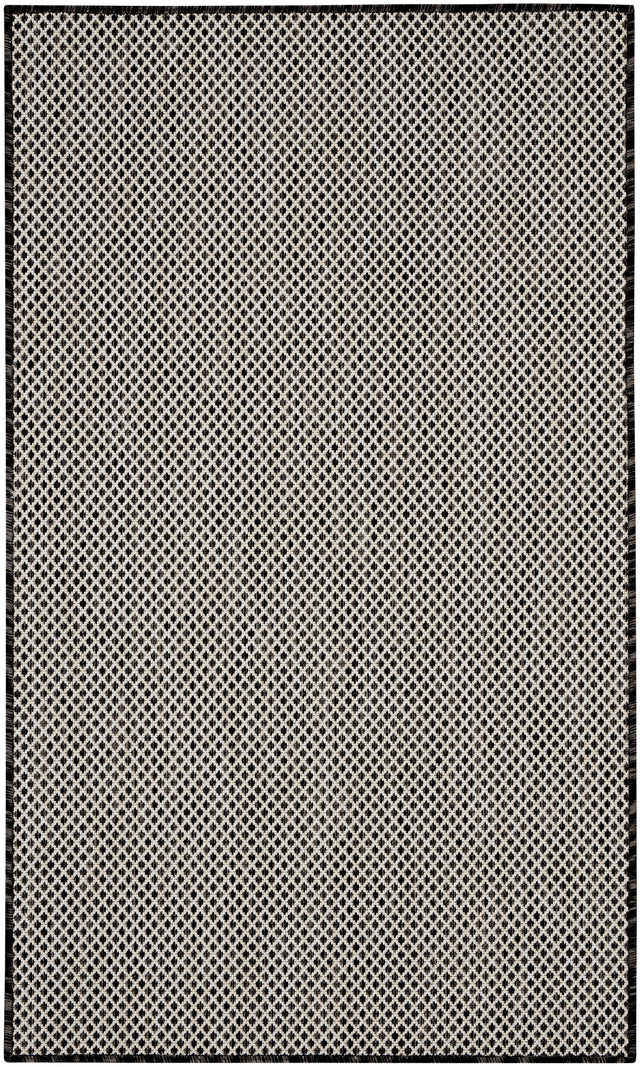 Black and white geometric lattice area rug with dark outer frame
