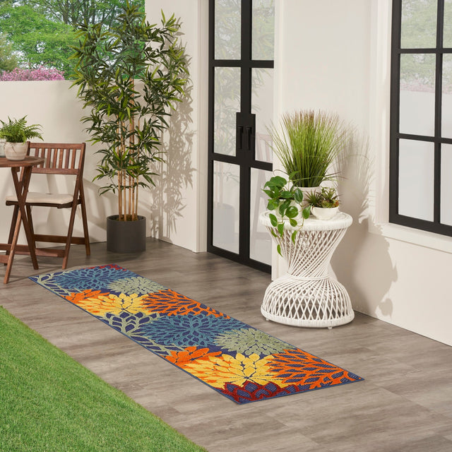 Nourison Aloha multicolor runner rug with navy base and orange yellow floral geometric pattern