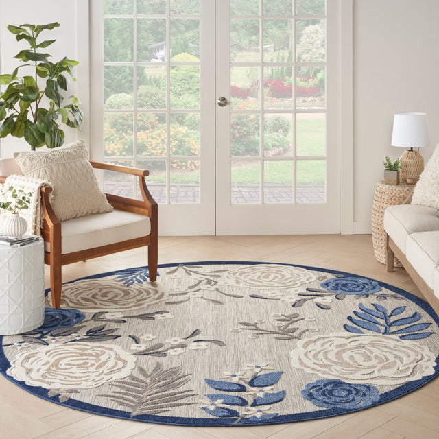 Nourison Aloha blue-gray and ivory round rug with scrolling floral medallions
