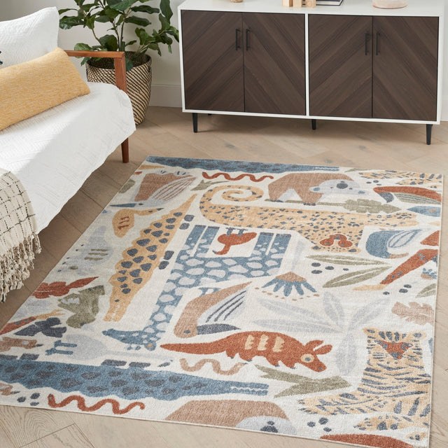 Ivory rectangular area rug with blue, tan, and rust animal safari pattern