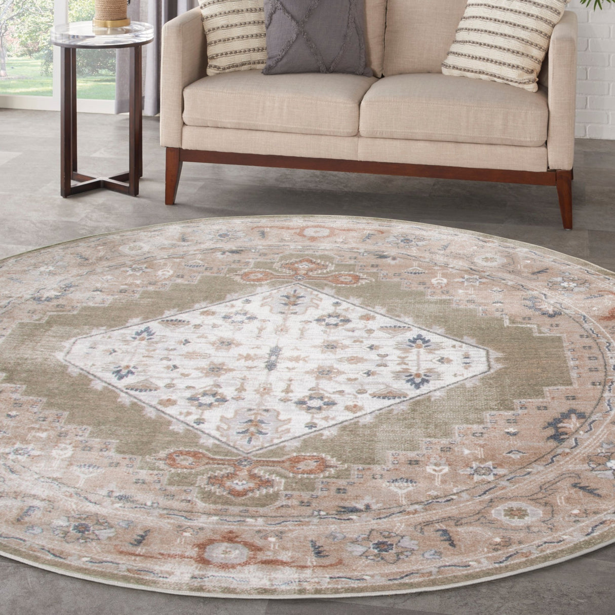 Round sage multi area rug with central diamond motif and detailed border in beige and blue