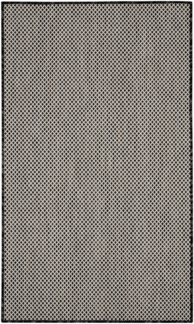 Black and white geometric lattice area rug with dark outer frame