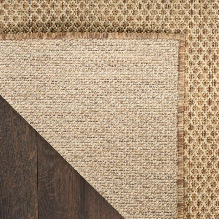 Jute rug corner with tight weave and braided border trim
