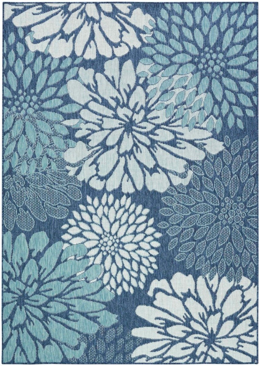 Navy and light blue rectangular area rug with large white flower and leaf pattern