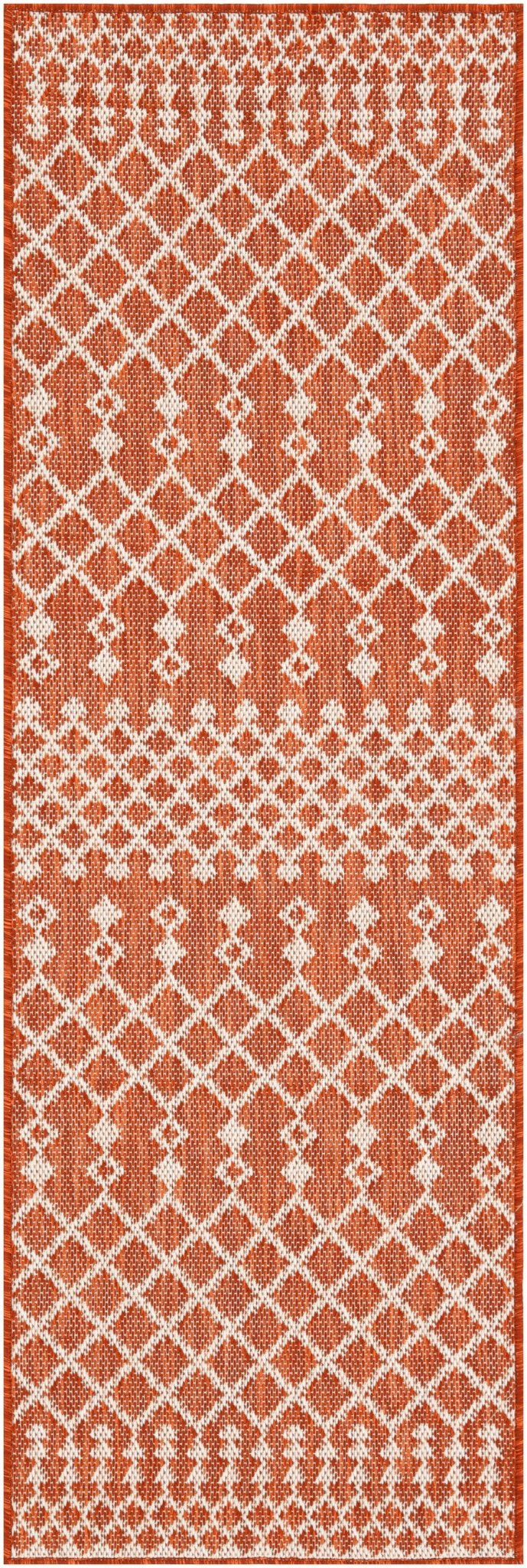 Terracotta rectangular rug with white geometric diamond pattern border