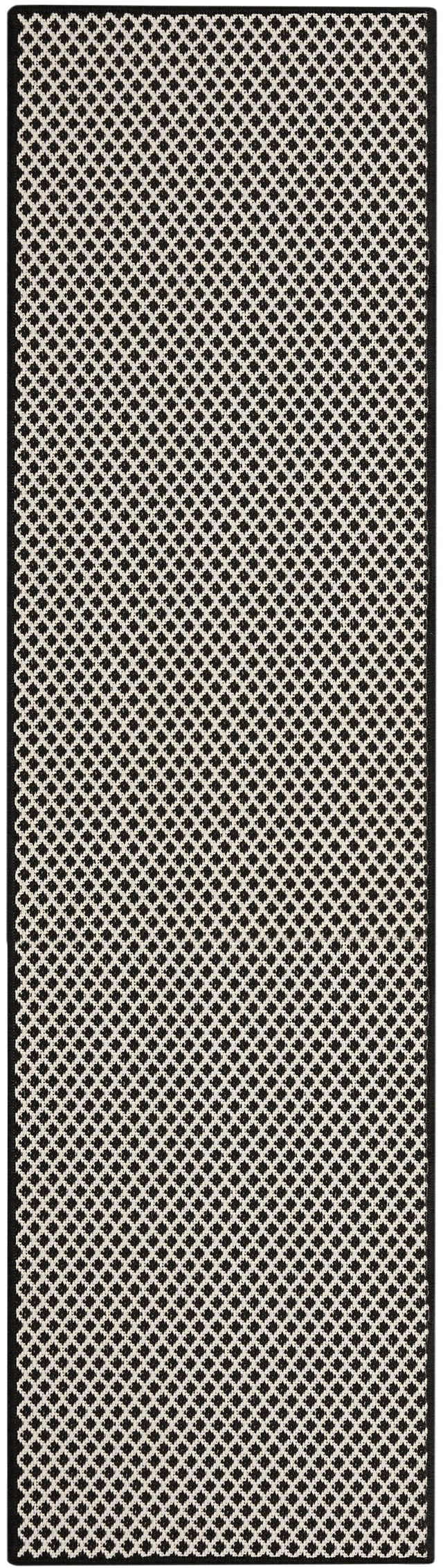Black and white long rectangular rug with repeating lattice design