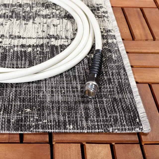 Safavieh Courtyard 6'-7" x 9'-6" Rug in Grey / Black