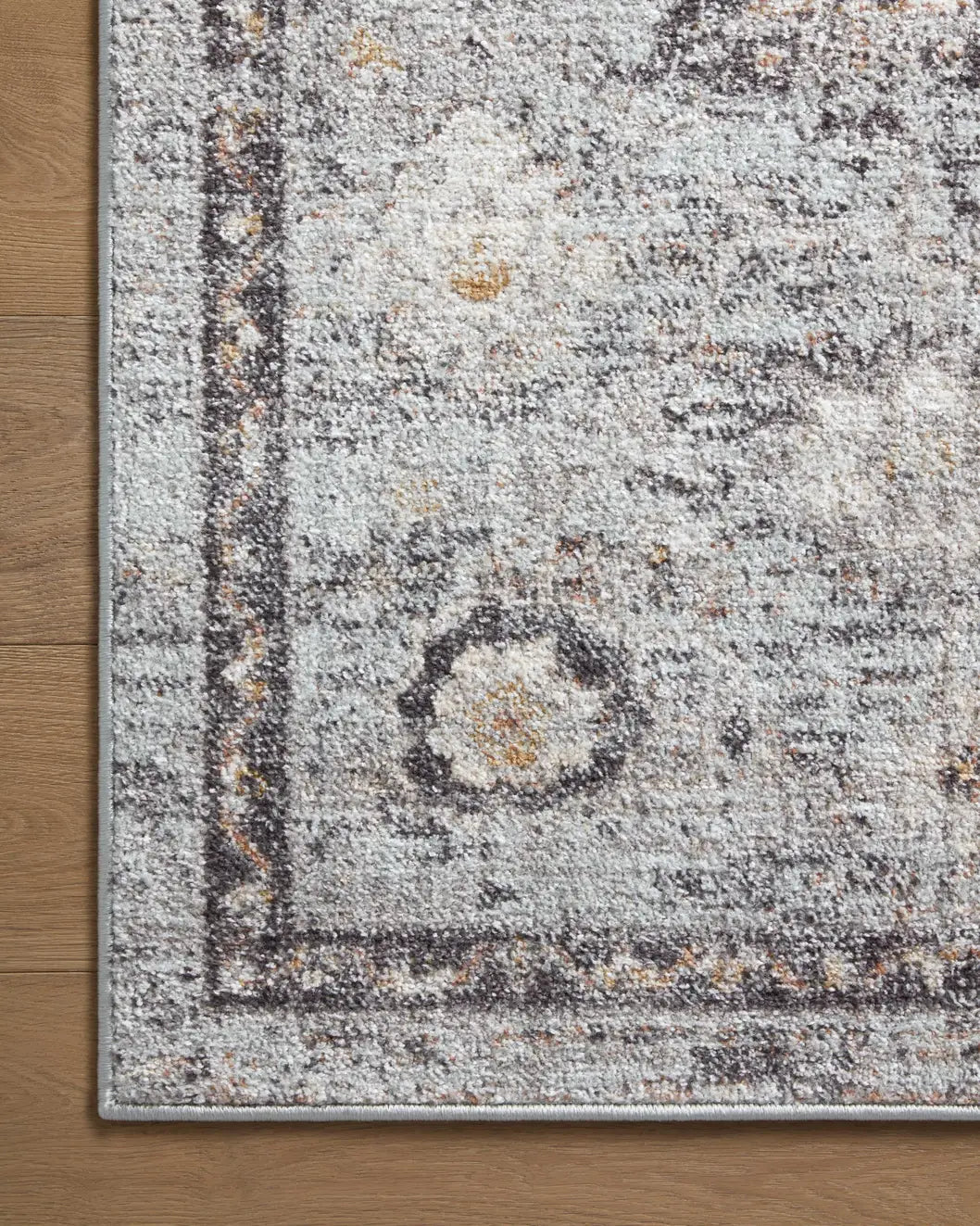 Loloi Monroe Mon-04 Sky/Gold Rug - corner on wood