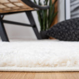 Safavieh Moroccan Tassel Shag 4'-0" x 6'-0" Rug in Ivory / Grey