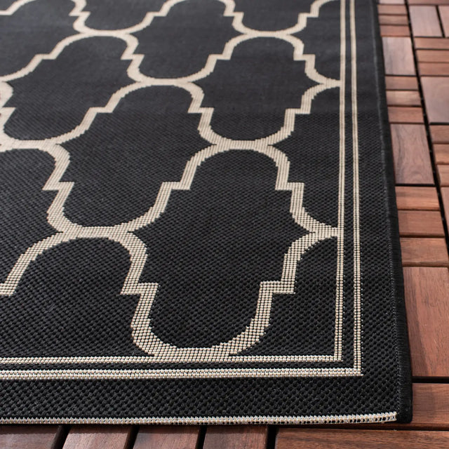Safavieh Courtyard 5'-3" x 7'-7" Rug in Black / Beige