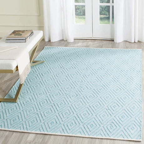 Safavieh Montauk 5'-0" x 7'-0" Rug in Turquoise / Ivory