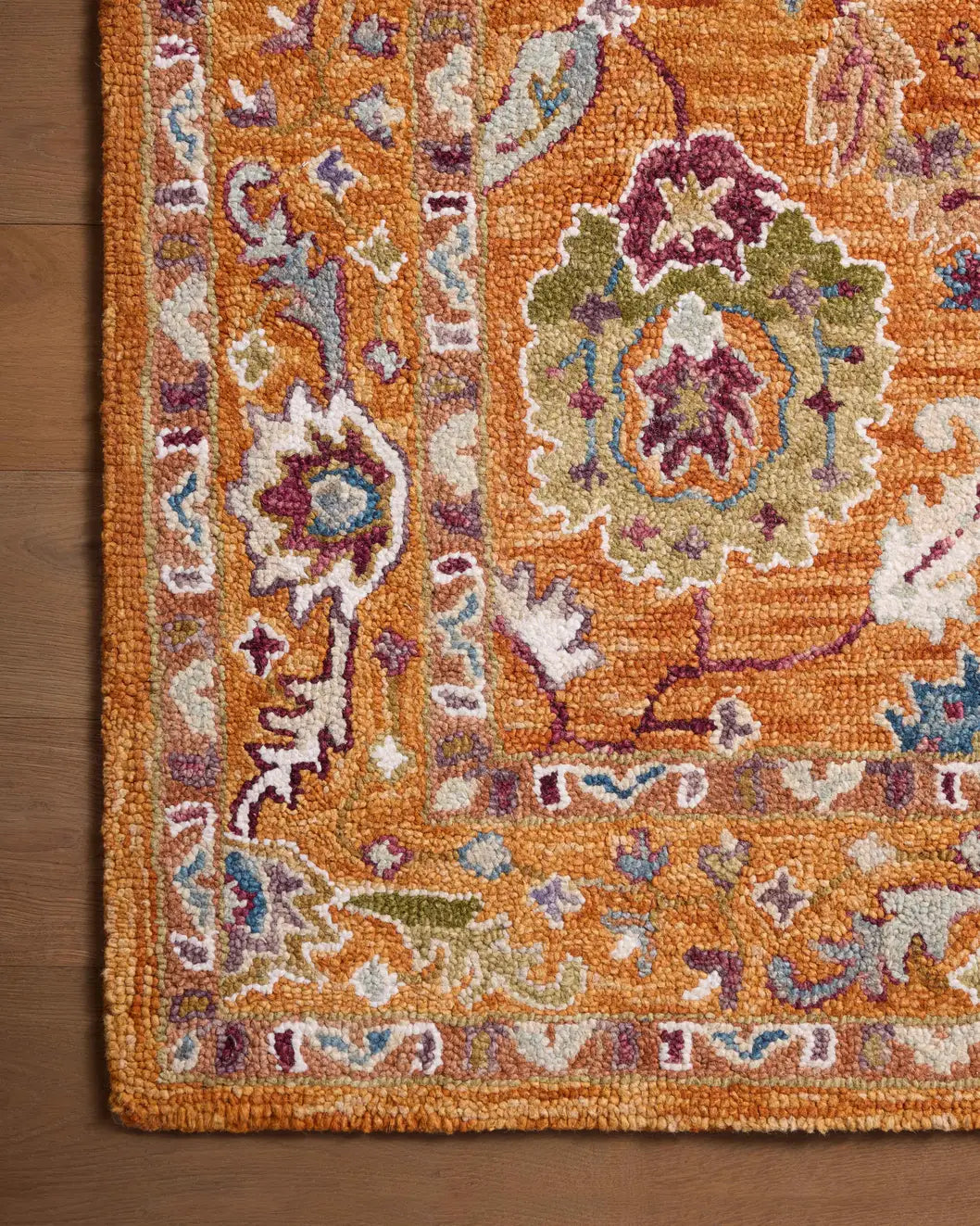 Loloi Padma Pma-01 Orange/Multi Rugs - corner on wood