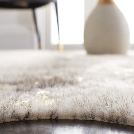 Safavieh Faux Cowhide 5'-0" x 6'-5" Rug in Beige / Grey