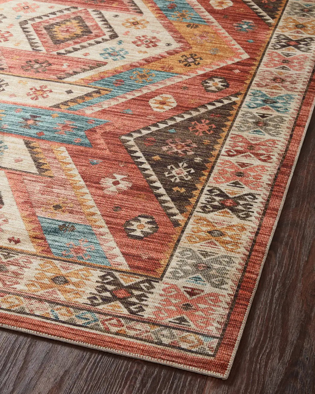 Loloi Zion Zio-05 Red/Multi Rugs - angled corner on wood