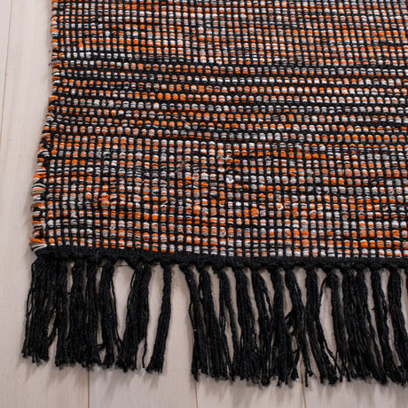 Safavieh Montauk 4'-0" x 6'-0" Rug in Orange / Black