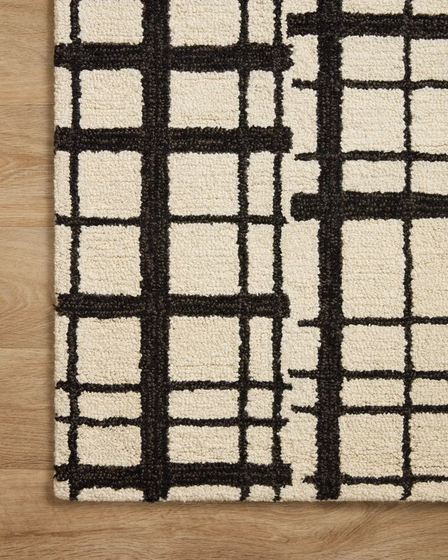 Chris Loves Julia x Loloi Polly POL-02 Black / Ivory Rug - corner on wood