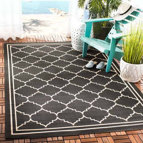 Safavieh Courtyard 4'-0" x 5'-7" Rug in Black / Creme