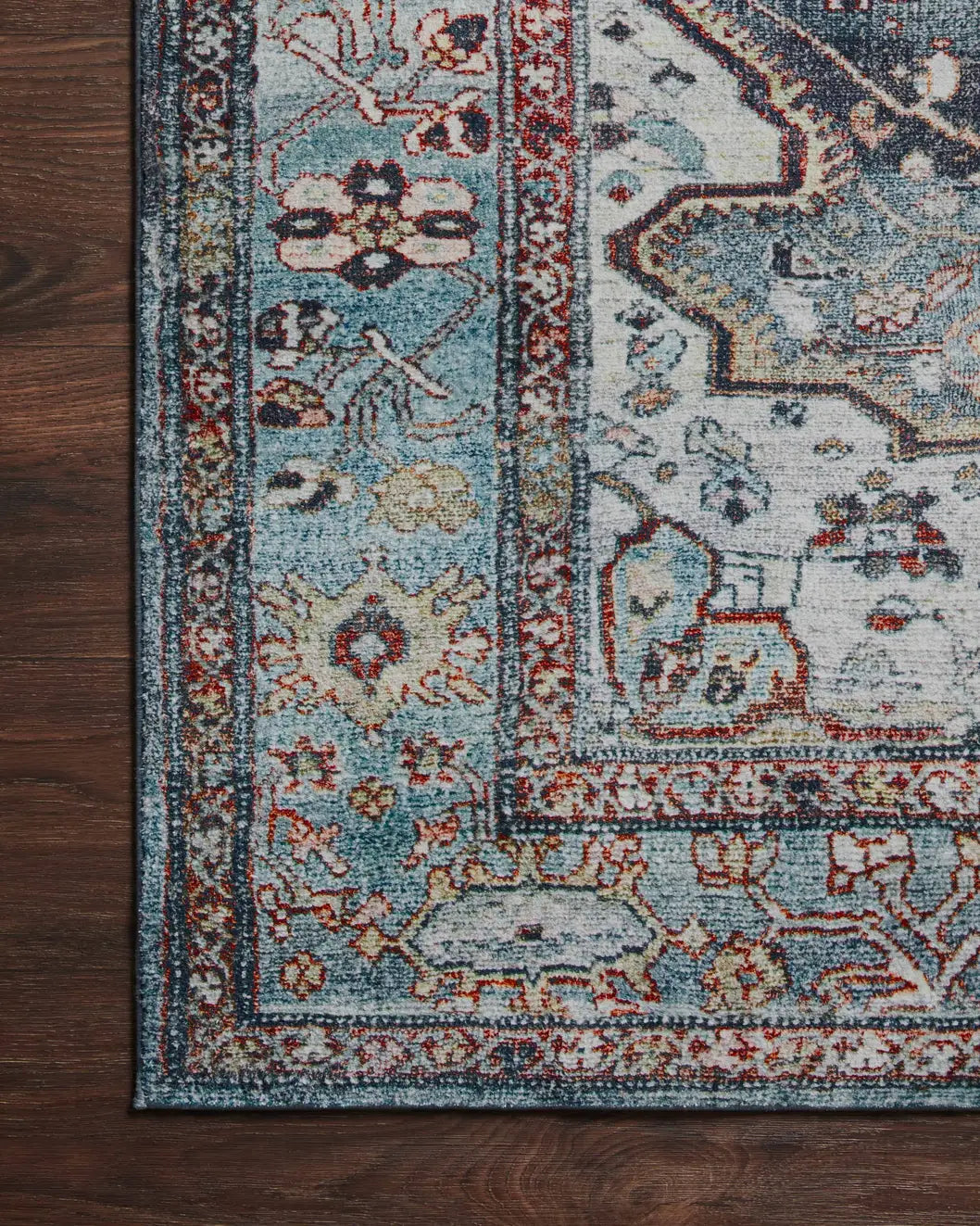 Loloi Margot Mat-05 Ocean/Brick Rugs - corner on wood