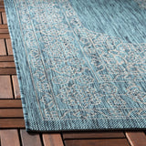 Safavieh Courtyard 4'-0" x 5'-7" Rug in Teal / Ivory