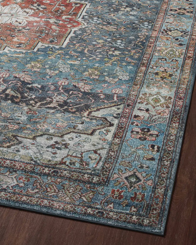 Loloi Margot Mat-05 Ocean/Brick Rugs - angled corner on wood