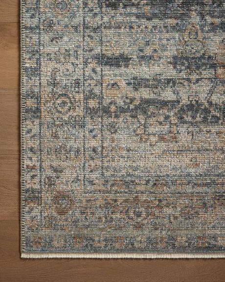 Loloi Heritage Her-09 Sky/Sunset Rug - corner on wood