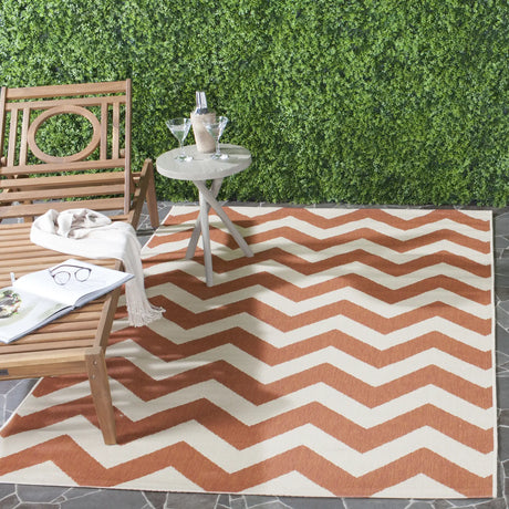 Safavieh Courtyard 5'-3" x 7'-7" Rug in Terracotta / Beige