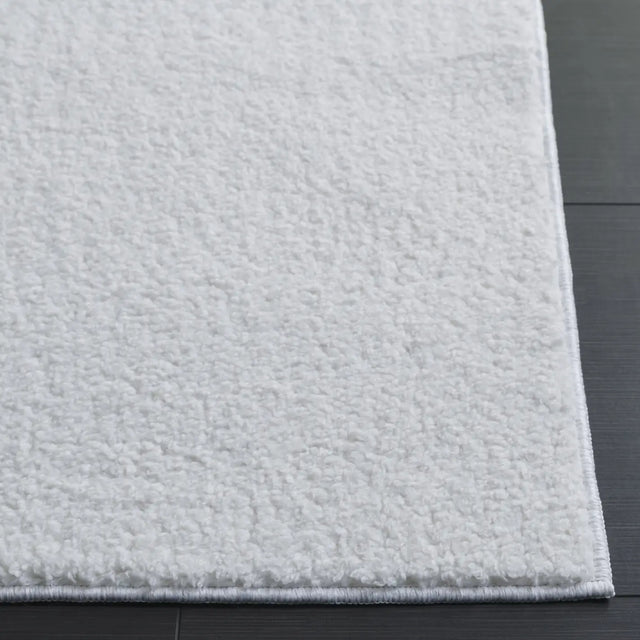 Safavieh Boucle 100 5'-0" x 7'-0" Rug in Ivory
